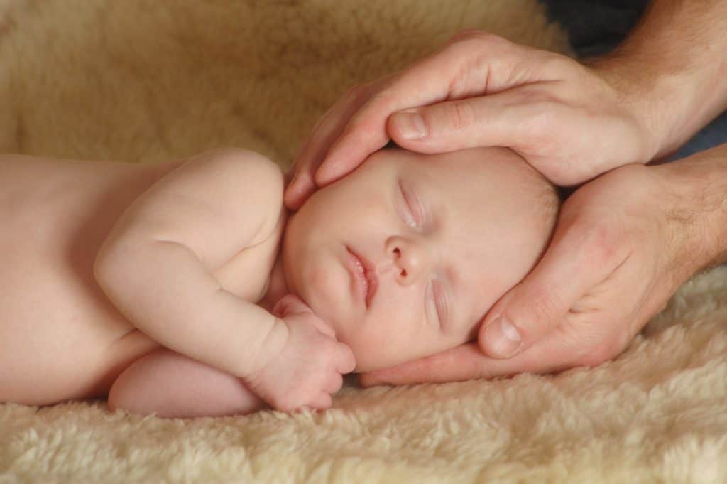 Image of baby receiving gentle osteopathy.